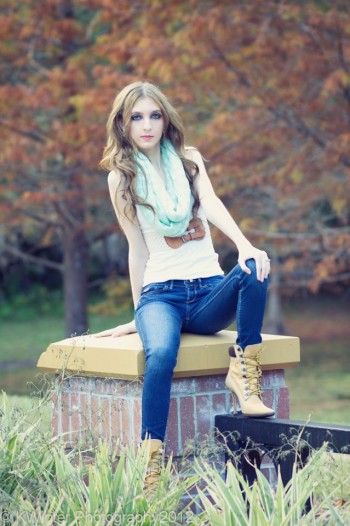 Brittany Alexander wearing boots and jeans at the countryside