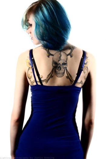 Brittany M showing her back tattoos