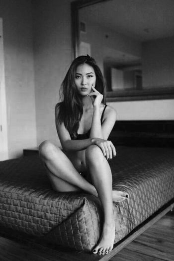 Cassie Wong modeling underwear in bed