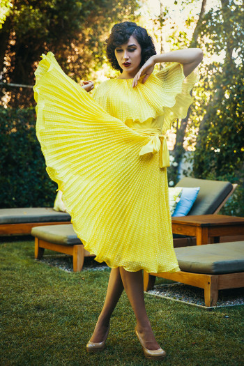 Colette Stone wearing a yellow dress