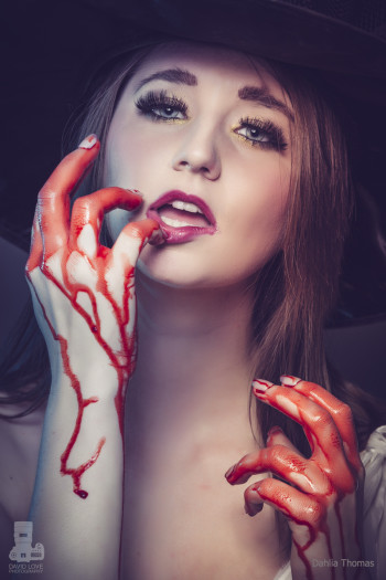 Dahlia Thomas sucking blood from her hands