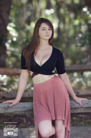 Dahlia Thomas wearing a pink skirt in the woods