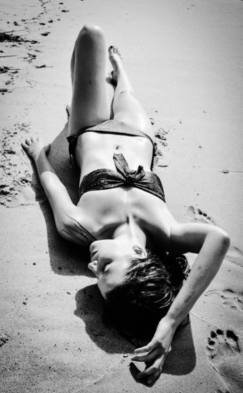 Julia Piper lying on the beach