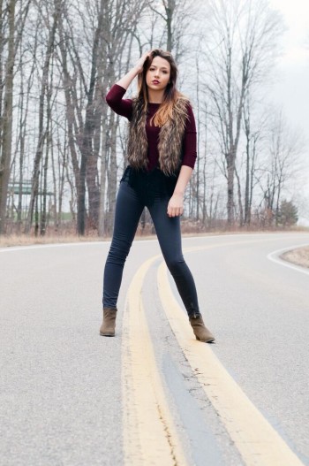 Olivia Black standing in the middle of a road