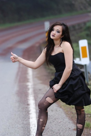 Raven Lynette in a black dress asking for a ride