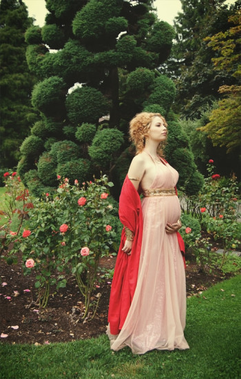 Samm Harrison pregnant in old-fashioned dress