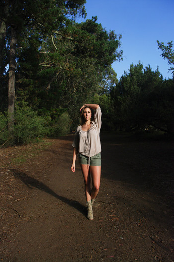 Veronica Dean walking in the woods