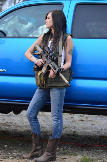 Beth Wheeler holding an automatic gun
