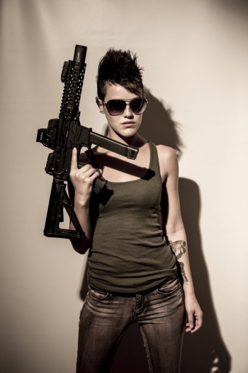 Brooke holding a badass gun