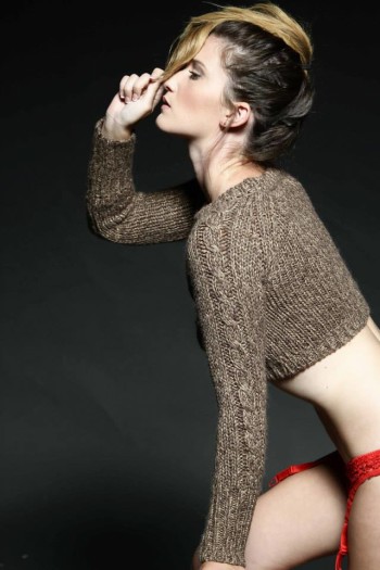 Elizabeth Arey wearing a sweater and red lingerie