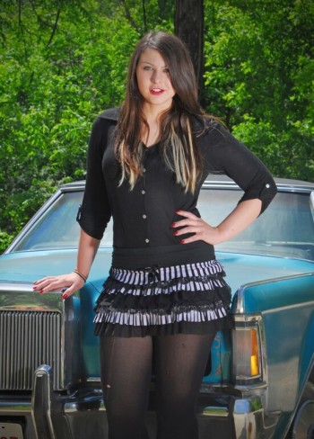 Kiri Ann Fischer modeling a black mini skirt
