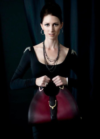 Lauren Ashlee Boyette holding a curvy handbag