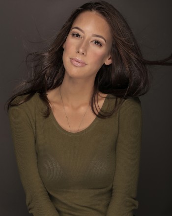 Mary Casarreal wearing a green sweater
