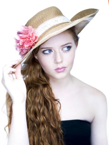 Sophia Harris showing her long hair and a hat